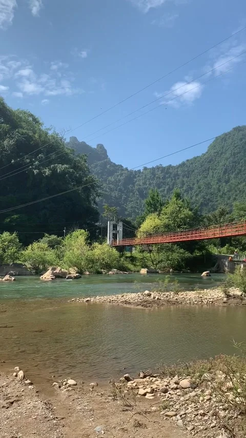 River and bridge in Vang Vieng 動画素材 343320242