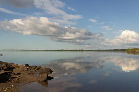 River and clouds with reflection Stock Photos