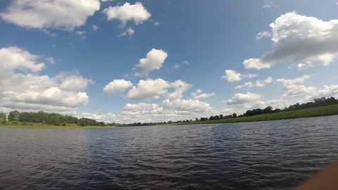 River and cloudy sky. slow camera transition from water to sky Stock Footage 120117753