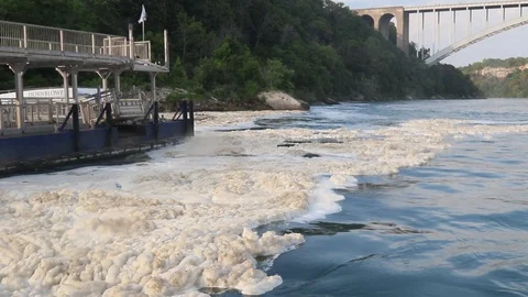 River and foam, Bridge in Background Stock Footage 114017803