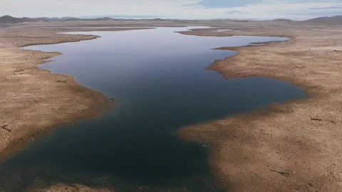River and lake drying up, leaving the ground exposed. Arid riverbed, drought Stock Footage 142004390