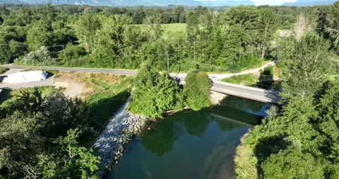 River and road bridge, farm and industrial Pt 2 of 3 - 5K Video stock 226800541