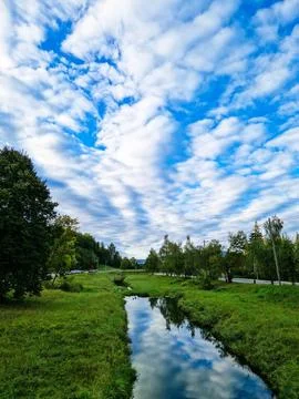 River and Sky Reflection in a Serene Landscape Stock Photos