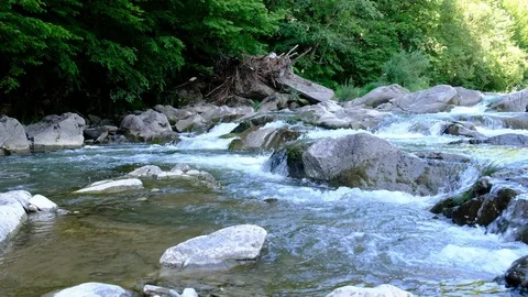 The river and small rapids, In the woods from the mountains flow beautifully the Stock Footage 102652577