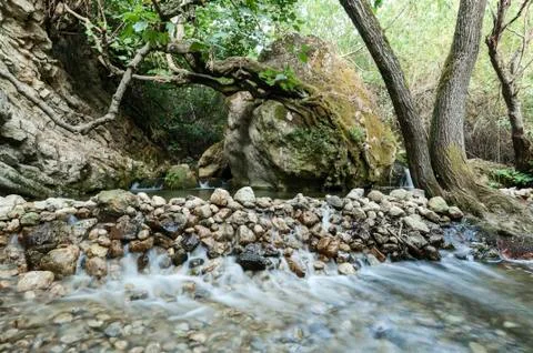 River and stone wall Stock Photos