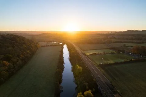 River and tracks into sunset Foto stock