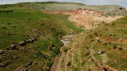 A river and waterfall flowing between two mountains Stock Footage 258227583
