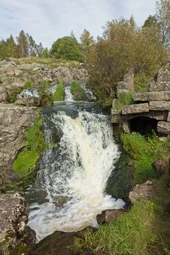 River and waterfall. Fotos de archivo