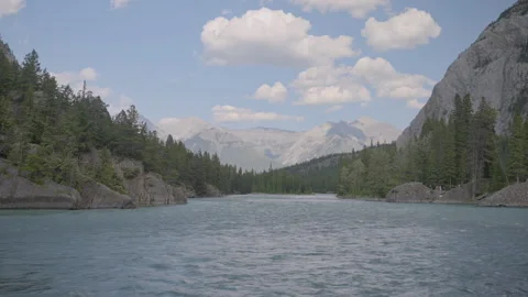 River in Banff with mountains in the background Stock Footage 211878852