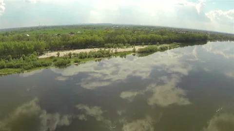 River bank and reflections of clouds. Aerial Stock Footage 37995400