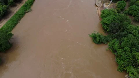 The river bank collapsed due to heavy rain and strong water flow. Stock Footage 217422352
