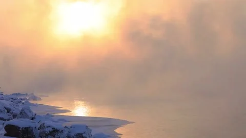 The river Bank is covered with a thick layer of frost and snow. Ice on the river Stock Footage 143394832