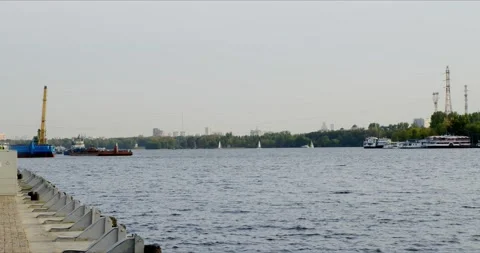 River barge and floating crane with a lot of sailng boats near Rechnoy Stock Footage 140888351