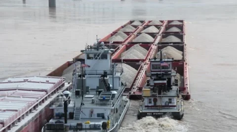 RIVER BARGE FILLED WITH GRAVEL ON OHIO RIVER, TUGS PUSHING, FROM BEHIND Stock Footage 59184062