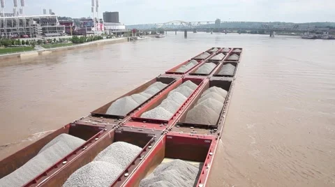RIVER BARGE,  FILLED WITH GRAVEL, PUSHED BY TUGS ON RIVER Stock Footage 59184066