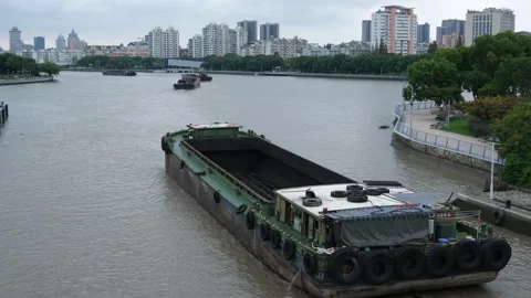 A river barge navigating the waterway and moving forward in Ningbo China Vídeos de archivo 289626541