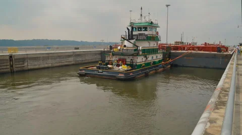 River Barge Passes Through Dam Locks 스톡 동영상 64803345