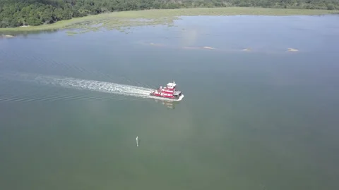 A river barge sails off Hilton Head in this aerial shot Stock Footage 140294422