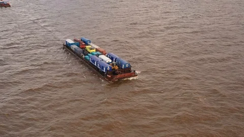 The river barge on the tow floats down the river Ob. Stock Footage 120588194