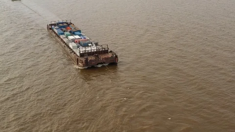 The river barge on the tow floats down the river Ob. Stock Footage 120588319