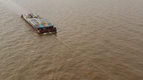 The river barge on the tow floats down the river Ob. Stock Footage 120588340