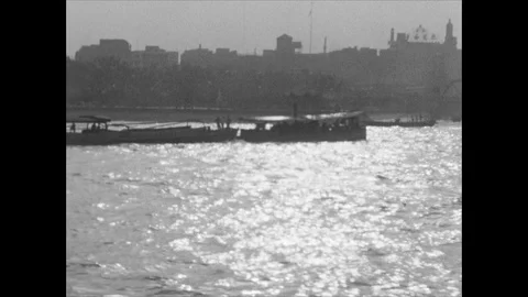 River barges are sailing through city river and anchor at the port, 1939 China Video stock 131526769