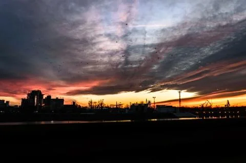 The river bed in the coal unloading zone at the thermal power plant, sunset. 스톡 사진