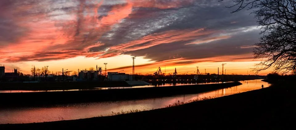 The river bed in the coal unloading zone at the thermal power plant, sunset. Stock Photos