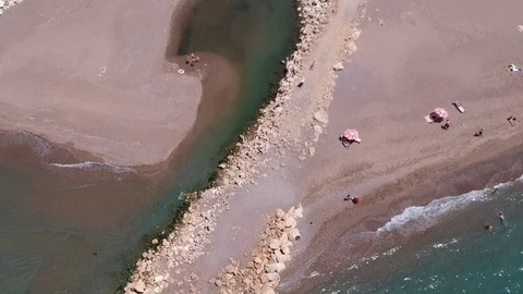 River bed flow into sea on sandy beach Stock Footage 111072389
