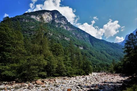 River bed of the Verzasca river with dramatic landscape Stock Photos