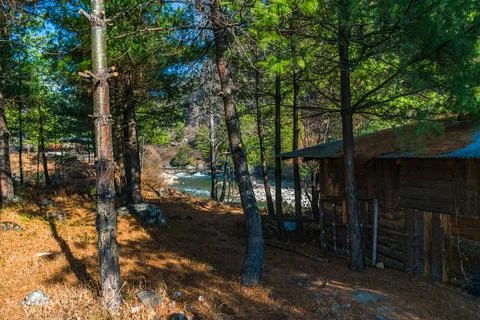 River behind the log cabin Stock Photos