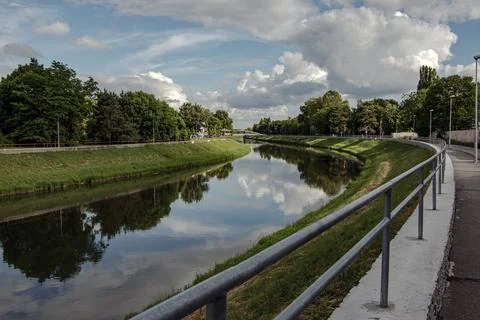 River Bend with Reflections and Riverside Path Stock Photos
