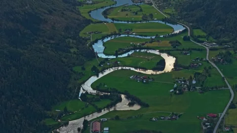 River bends through farmlands and valleys close to Stryn, Norway Stock Footage 320995632