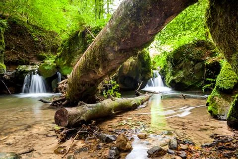River beside a large boulder Stock Photos