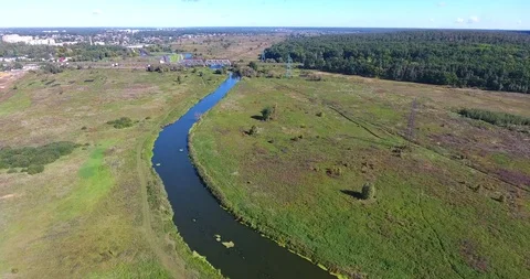 River between the city and the forest, railway bridge over the river Stock Footage 97003679