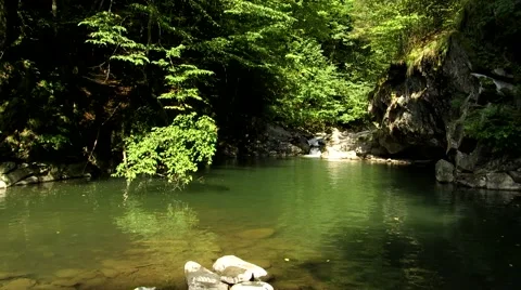 The river between the stones make lake Stock Footage 68807379