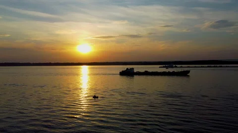 River with a bird's eye view, sunset, ferry floating Stock Footage 134481958