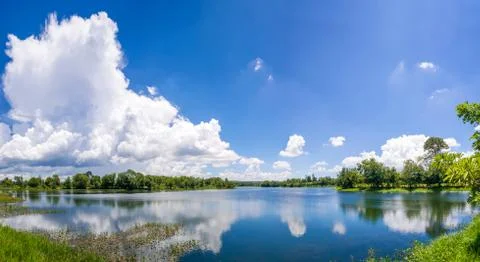 River with blue sky and cloud. Stock Photos