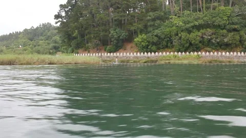 In a river by boat, relaxing Stock Footage 317546699