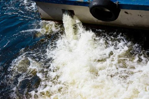 River boat using reverse speed, water floating backward Stock Photos