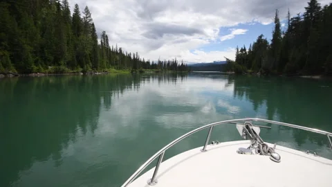 River boating on Clearwater River with reflection of clouds, Wells Gray Par.. Stock Footage 247092998