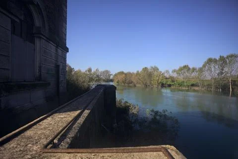 River bordered by trees in the countryside Stock Photos