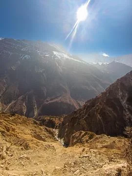 A river at the bottom of a deep mountain gorge. Stock Photos