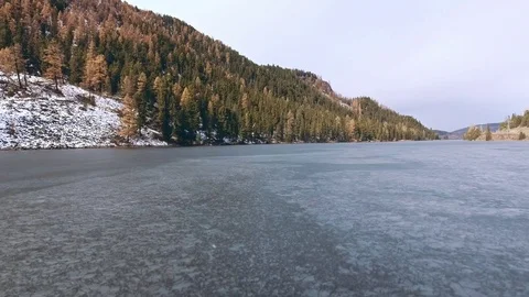 River is bound by a thin layer of ice in the early spring or autumn Video stock 82191409