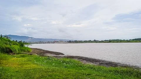 A river with a bridge in the background Foto stock