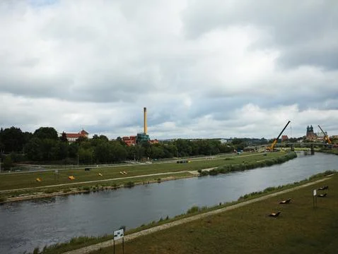 A river with a bridge in the background Stock Photos
