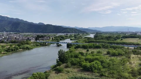 River Bridge Mountains and Vehicles in Nagano Japan Stock Footage 336617049