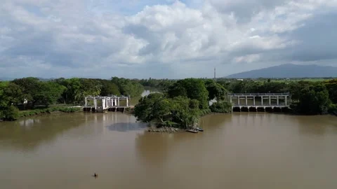 A river with a bridge over it. Aerial view at Kuala Sala, Kedah Video stock 325767138