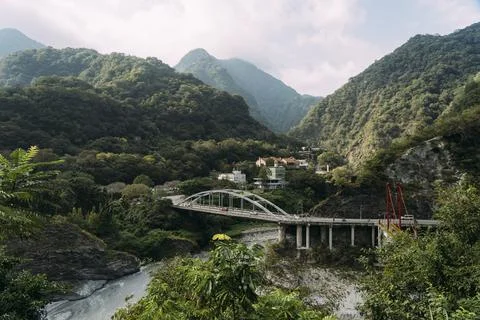 River with bridge, small town and mountains in Taroko National Park, Taiwan. Stock Photos
