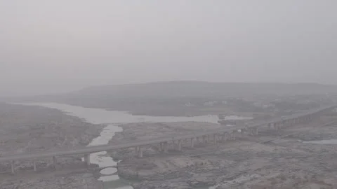 River Bridge Spanning River Valley Aerial - Ungraded Stock Footage 322542370